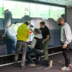 Miners: Communication and Awareness in Collaborative Gaming at an Interactive Display Wall